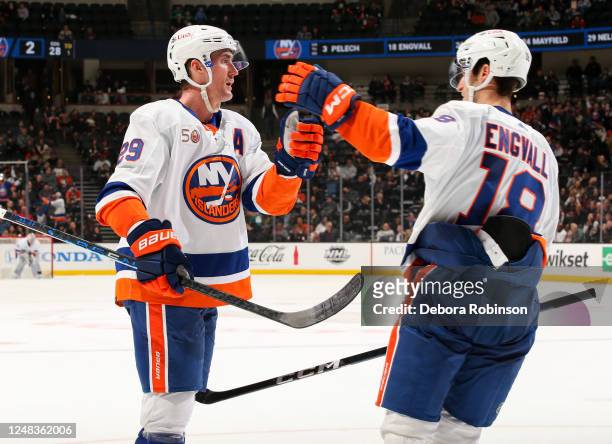 Brock Nelson of the New York Islanders celebrates his goal with teammates during the second period against the Anaheim Ducks at Honda Center on March...