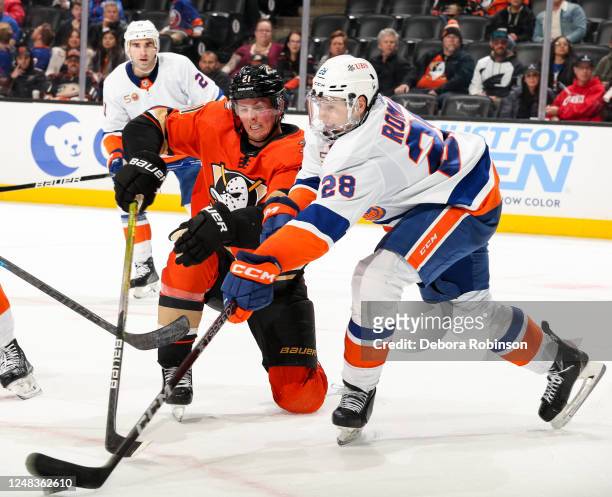Isac Lundestrom of the Anaheim Ducks and Alexander Romanov of the New York Islanders battle for position during the third period at Honda Center on...