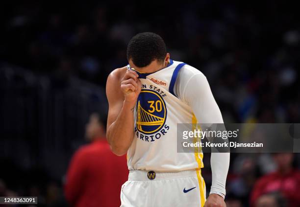 Stephen Curry of the Golden State Warriors reacts during the second half against the Los Angeles Clippers at Crypto.com Arena on March 15, 2023 in...