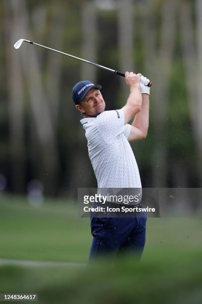 Justin Rose of England hits an approach shot at the 7th hole during the first round of THE PLAYERS Championship on THE PLAYERS Stadium Course at TPC...