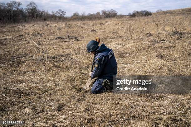 The team member of the Ukrainian State Emergency Service Unit demines in the Industrialnyi district of Kharkiv region, Ukraine on March 15, 2023. The...