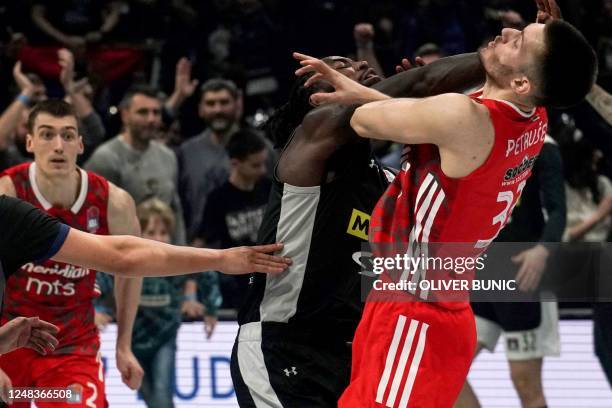 Partizan's French basketball player Mathias Lessort scuffles with Red Star Filip Petrusev after the ABA league basketball match between Partizan...