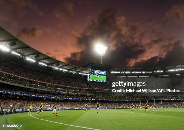 Dustin Martin of the Tigers kicks the ball as a general view is seen during the 2023 AFL Round 01 match between the Richmond Tigers and the Carlton...