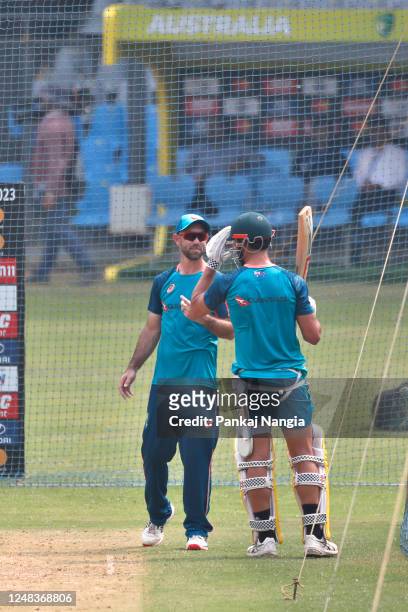 Glenn Maxwell of Australia and Marcus Stoinis of Australia talk during an Australian ODI squad training session at Wankhede Stadium on March 16, 2023...