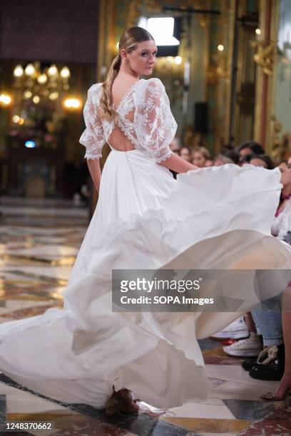 Model showcases creations by Silvia Fernandez during the Atelier Couture bridal catwalk within Madrid Fashion Week, at Santa Isabel Palace in Madrid.
