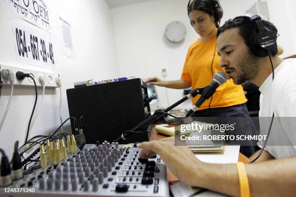 Young Israeli rebels against the imminent pullout from the Gaza Strip operate a pirate radio station at the southern Gaza Strip Settlement bloc of...