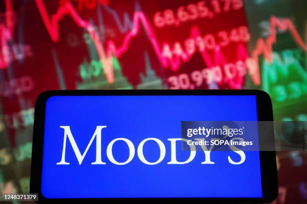 In this photo illustration, Moody's Investors Service logo is seen on a smartphone screen.