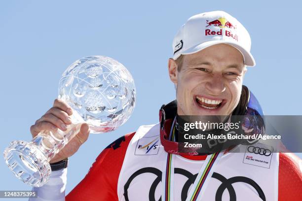 Marco Odermatt of Team Switzerland wins the globe in the overall standings during the Audi FIS Alpine Ski World Cup Finals Men's and Women's Super G...