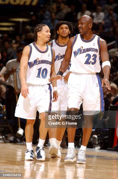 Michael Jordan of the Washington Wizards talks with Tyronn Lue during the game against the Minnesota Timberwolves on January 25, 2003 at the MCI...