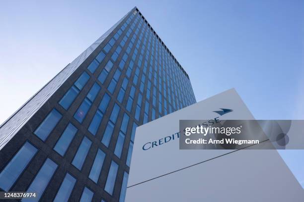 The logo of Swiss bank Credit Suisse is seen the day after its shares dropped approximately 30%, on March 16, 2023 in front of its Oerlikon office...