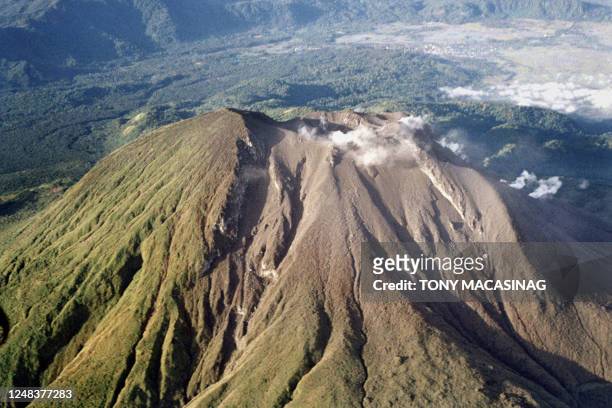 The clear summit of Mount Bulusan volcano in Sorsogon province shows a little steam and huge deposits of ash and volcanic materials in this aerial...