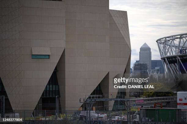 The V&A East Museum is seen under construction, with Canary Wharf behind, at the Queen Elizabeth Olympic Park in east London on March 16, 2023....