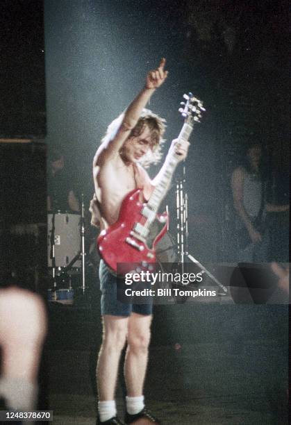 July 1983]: MANDATORY CREDIT Bill Tompkins/Getty Images on Angus Young lead guitarist of AC/DC performs at Madison Square Garden July 1983 in New...