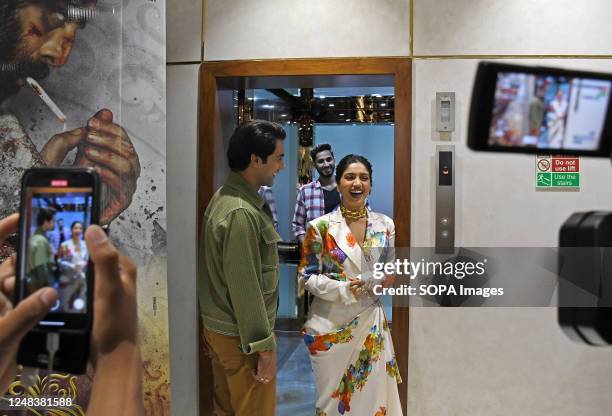 Bollywood actors Rajkummar Rao and Bhumi Pednekar share a candid moment as they leave after a photo op to promote their upcoming film 'Bheed' in...