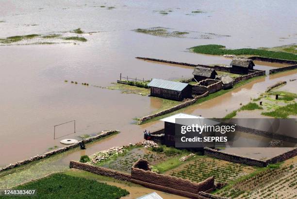 Photo taken 25 January 2003 of a town affected by the flooding of the Huancane river in Azangaro, Peru. On January 29, up to thirty thousand people...