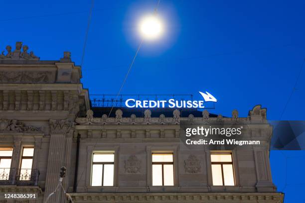 The company logo is seen at the global headquarters of Swiss bank Credit Suisse the day after its shares dropped approximately 30% on March 16, 2023...