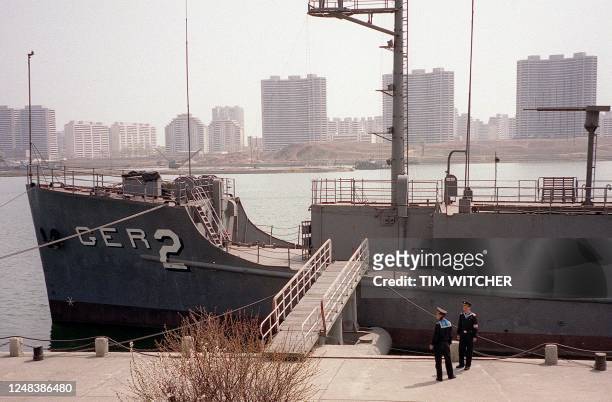 North Korean navy ratings guard the USS Pueblo, an American spy ship, on the river Taedong in central Pyongyang 16 April 2001. The ship was attacked...