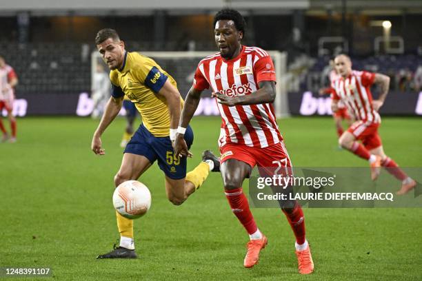 Union's Ismael Kandouss and Berlin's Sheraldo Becker fight for the ball during a soccer game between Belgian Royale Union Saint-Gilloise and German...