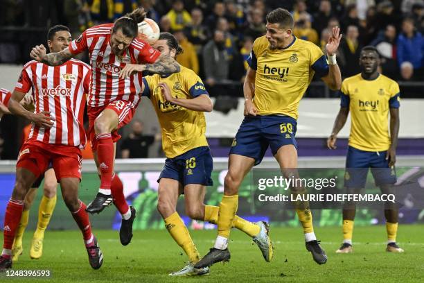 Berlin's Christopher Trimmel, Union's Christian Burgess and Union's Ismael Kandouss fight for the ball during a soccer game between Belgian Royale...