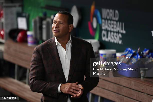 Former player Alex Rodriguez walks in the dugout prior to the game between Puerto Rico and the Dominican Republic at loanDepot park on March 15, 2023...