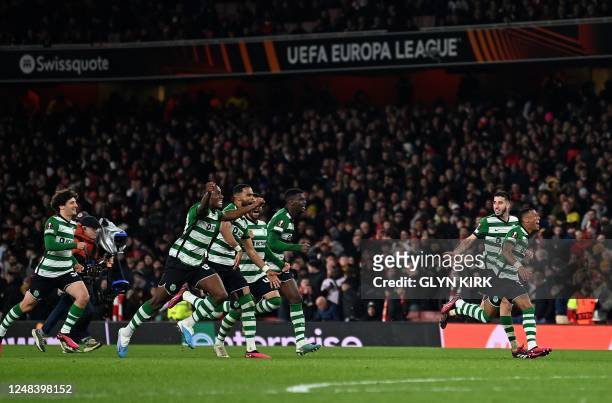 Sporting players celebrate after the winning penalty following extra time and a penalty shoot-out in the UEFA Europa League round of 16, second-leg...