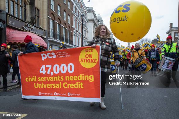 Fran Heathcote, President of the Public and Commercial Services Union , holds a banner during a Budget Day strike march by members from the civil...