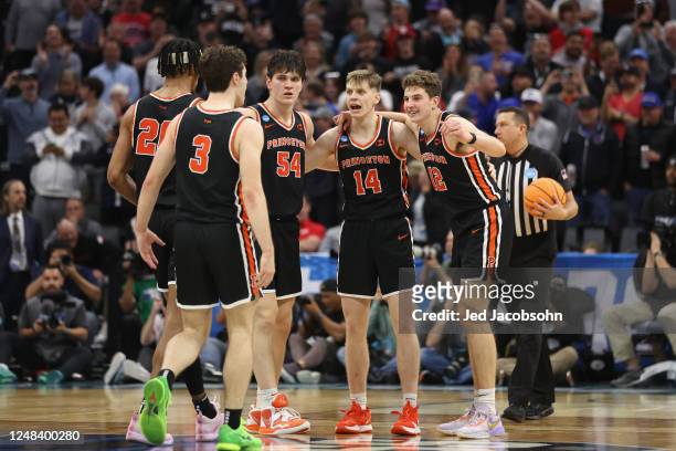Princeton Tigers players huddle up in the final moments of a win against the Arizona Wildcats during the first round of the 2023 NCAA Men's...