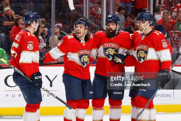 Teammates congratulate Ryan Lomberg of the Florida Panthers after he scored a first period goal against the Montreal Canadiens at the FLA Live Arena...