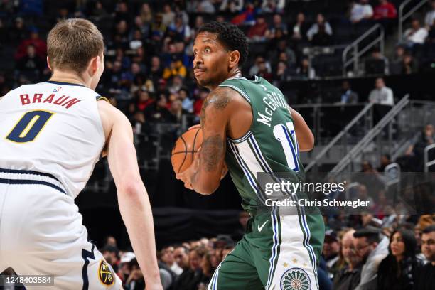 March 16: Rodney McGruder of the Detroit Pistons looks to pass the ball during the game against the Denver Nuggets on March 16, 2023 at Little...
