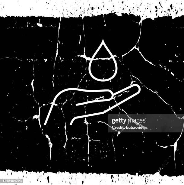 liquid drop in hand icon - water drop on black stock illustrations
