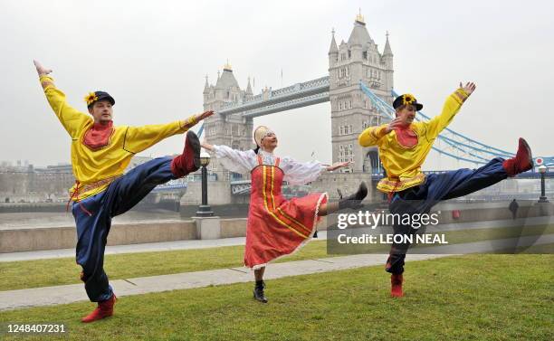 Russian Cossack dancers pose for photographers during a photocall near Tower Bridge in central London, to launch the "Maslenitsa" Russian Festival,...