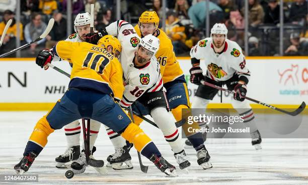 Colton Sissons of the Nashville Predators wins the face-off against Jujhar Khaira of the Chicago Blackhawks during an NHL game at Bridgestone Arena...