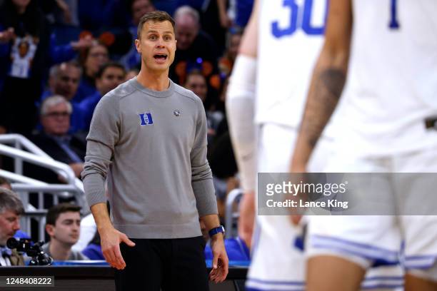 Head coach Jon Scheyer of the Duke Blue Devils directs his team against the Oral Roberts Golden Eagles during the second half in the first round of...