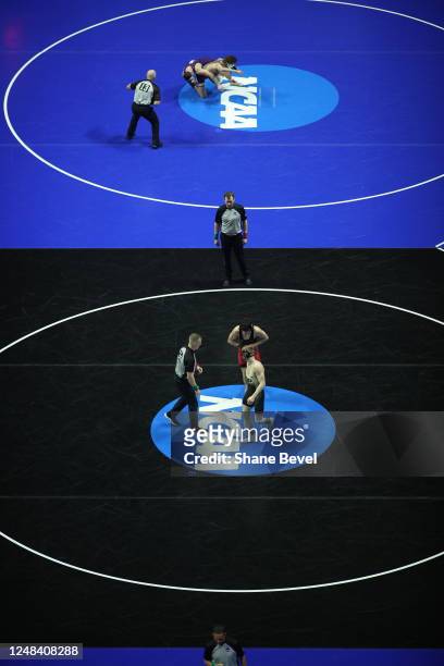 Wrestling matches are seen from overhead during the Division I Men's Wrestling Championship held at the BOK Center on March 16, 2023 in Tulsa,...