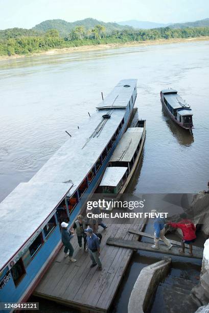 French tourists prepare to leave the Pak Ou caves on the banks of the Mekong river near Luang Prabang, Laos, 03 December 2004. Luang Prabang, added...