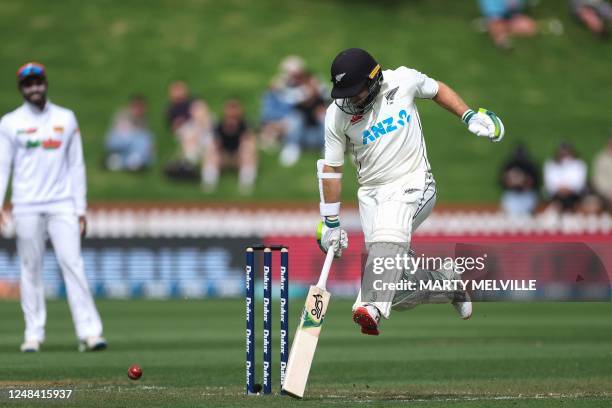 New Zealand's Tom Latham races the ball on day one of the second Test cricket match between New Zealand and Sri Lanka at the Basin Reserve in...