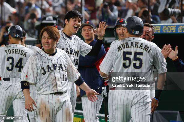 Munetaka Murakami of Team Japan celebrates with teammates after scoring in the fifth inning during the 2023 World Baseball Classic Quarterfinal game...