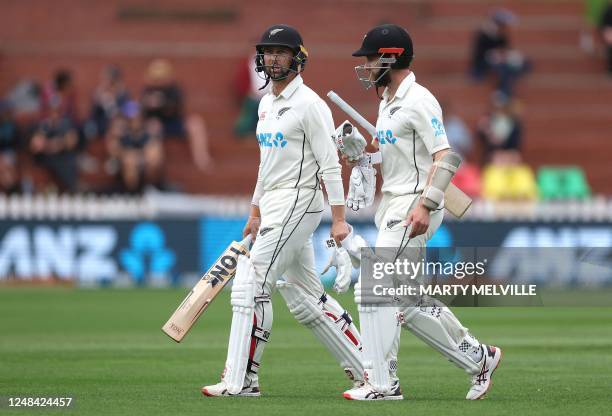 New Zealand's Devon Conway and teammate Kane Williamson walk from the field at tea on day one of the second Test cricket match between New Zealand...