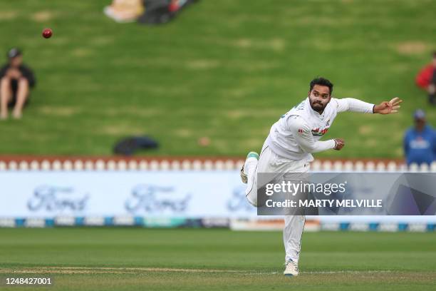 Sri Lanka's Dhananjaya de Silva bowls on day one of the second Test cricket match between New Zealand and Sri Lanka at the Basin Reserve in...