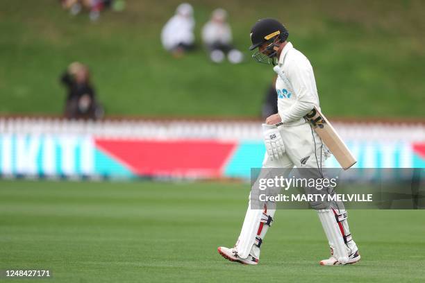 New Zealand's Devon Conway walks from the field after being caught on day one of the second Test cricket match between New Zealand and Sri Lanka at...
