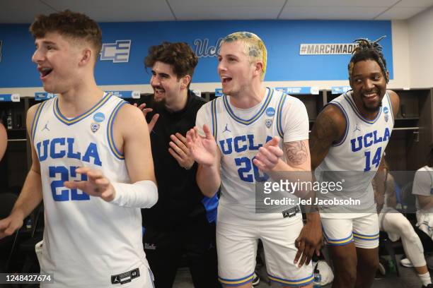 Jack Seidler, Logan Cremonesi and Kenneth Nwuba of the UCLA Bruins celebrate after a win against the North Carolina-Asheville Bulldogs during the...