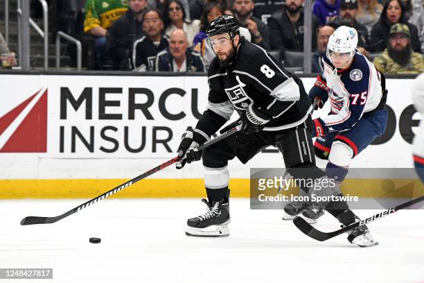 Los Angeles Kings Defenceman Drew Doughty looks to shoot the puck as Columbus Blue Jackets Defenceman Tim Berni applies defensive pressure during an...