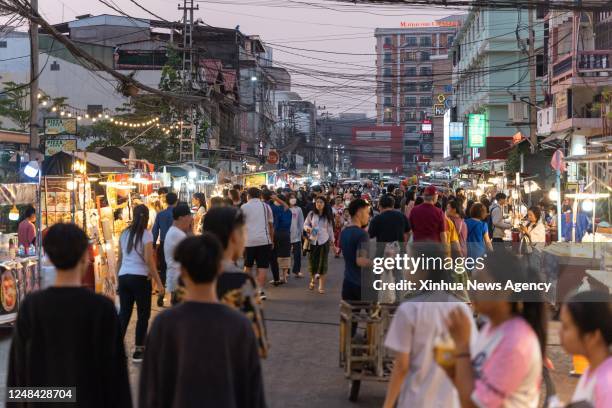 People visit a night market in Vientiane, Laos, March 14, 2023.