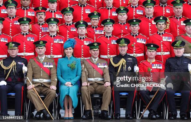 Britain's Prince William, Prince of Wales and Britain's Catherine, Princess of Wales pose for Officers' and Sergeants' Mess photographs during their...