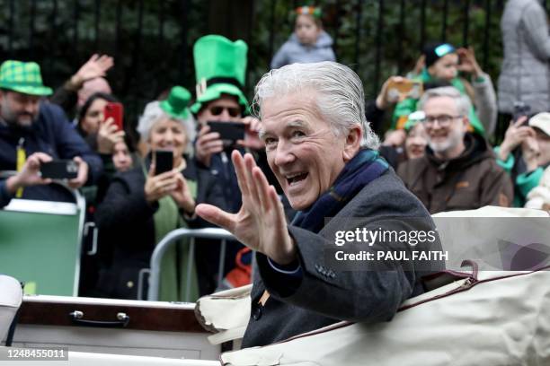 Nternational guest, US actor Patrick Duffy, at the head of the parade, waves to the crowds at the annual St Patrick's Day parade in Dublin on March...