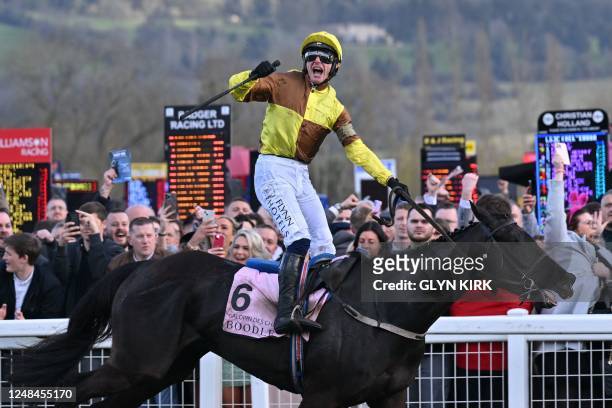 Jockey Paul Townend celebrates on Galopin Des Champs after winning the Cheltenham Gold Cup Chase race on the final day of the Cheltenham Festival at...