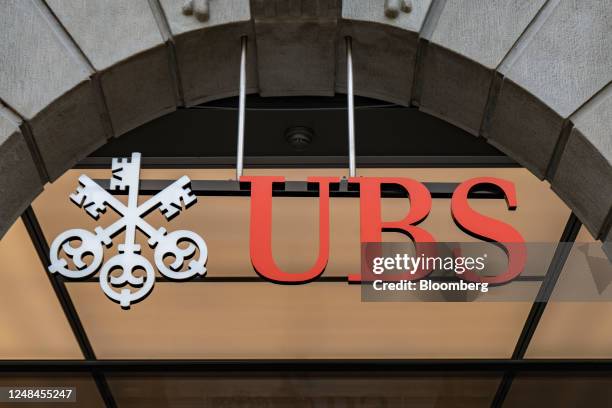 Sign above the entrance to the UBS Group AG headquarters in Zurich, Switzerland, on Friday, March 17, 2023. UBS and Credit Suisse Group AG are...