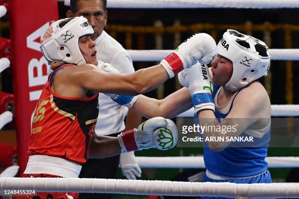 Russian boxer Saltanat Medenova in action against Emma-Sue Greentree of Australia during the preliminary round of the Elite women 75-81 kgs light...
