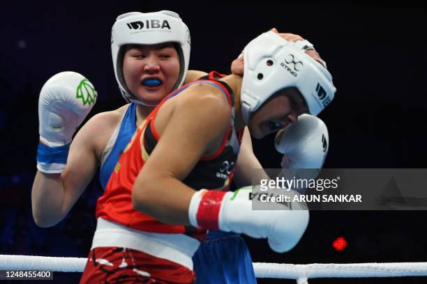 Russian boxer Saltanat Medenova in action against Emma-Sue Greentree of Australia during the preliminary round of the Elite women 75-81 kgs light...