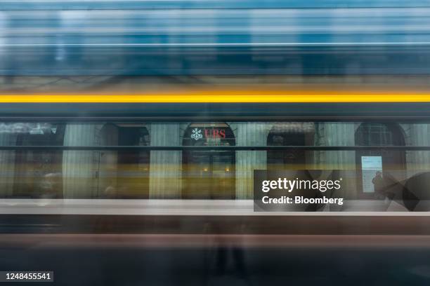 Tram passes the UBS Group AG headquarters in Zurich, Switzerland, on Friday, March 17, 2023. UBS and� Credit Suisse Group AG are opposed to a forced...